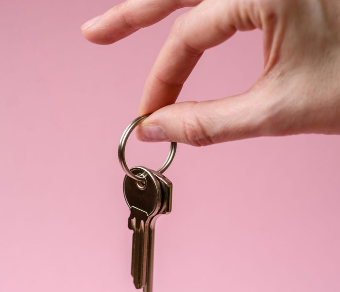 Home, house, buying property for business or life. Concept with human hand, house and keys